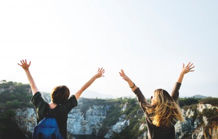 improve mental health, nature, two people with hands in the air