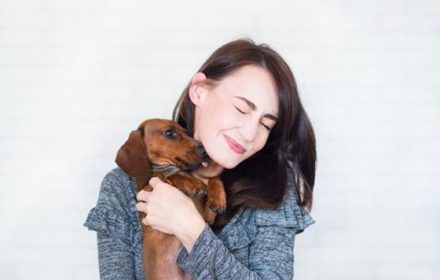 mental health benefits of pets, woman holding dog