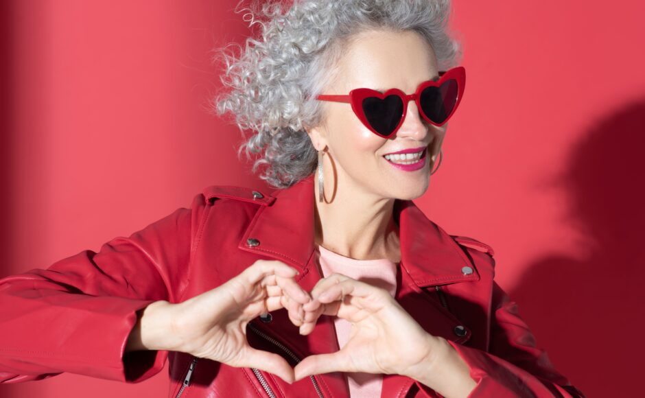 love yourself, woman making heart shape with hands